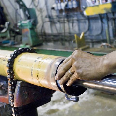 Dynamic Fluid Power technician repairing a hydraulic cylinder