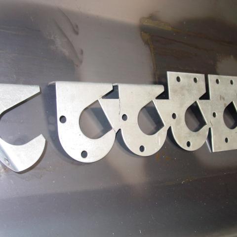 Progressive die strip designed and manufactured by Dynamic Machine Corp